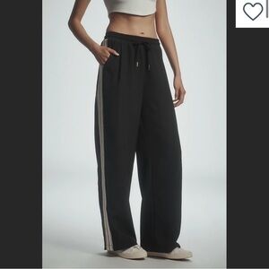 Anthropologie’s bishop + young Black Track Pants with White Stripes